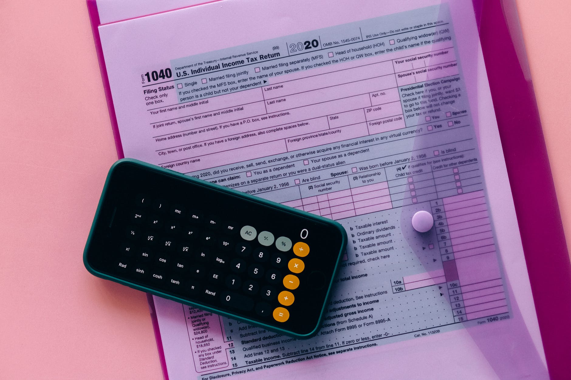 calculator and tax forms inside the clear envelope