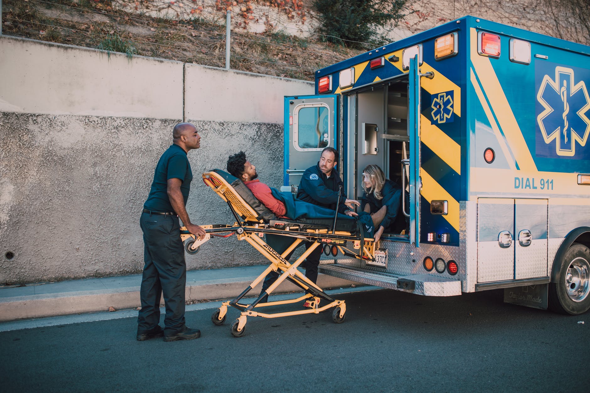 paramedics bringing man in a ambulance