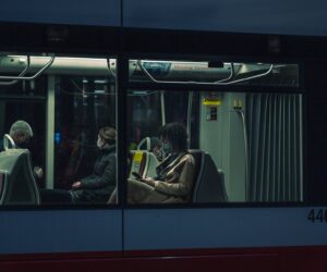 people on bus at night
