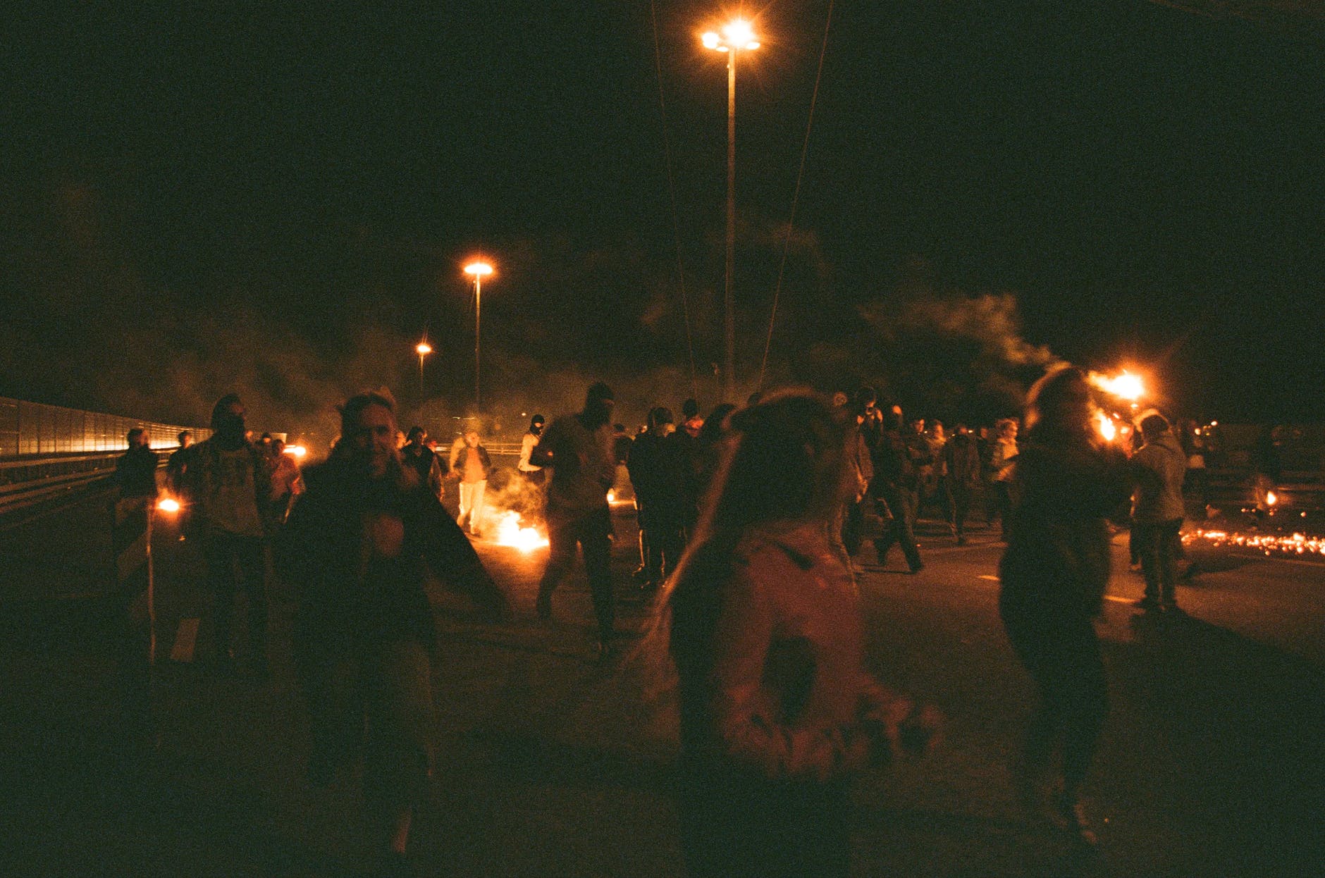 people at a protest at night