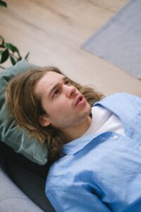 man lying on sofa during psychotherapy therapy