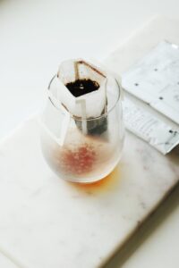 tea bag in clear glass cup
