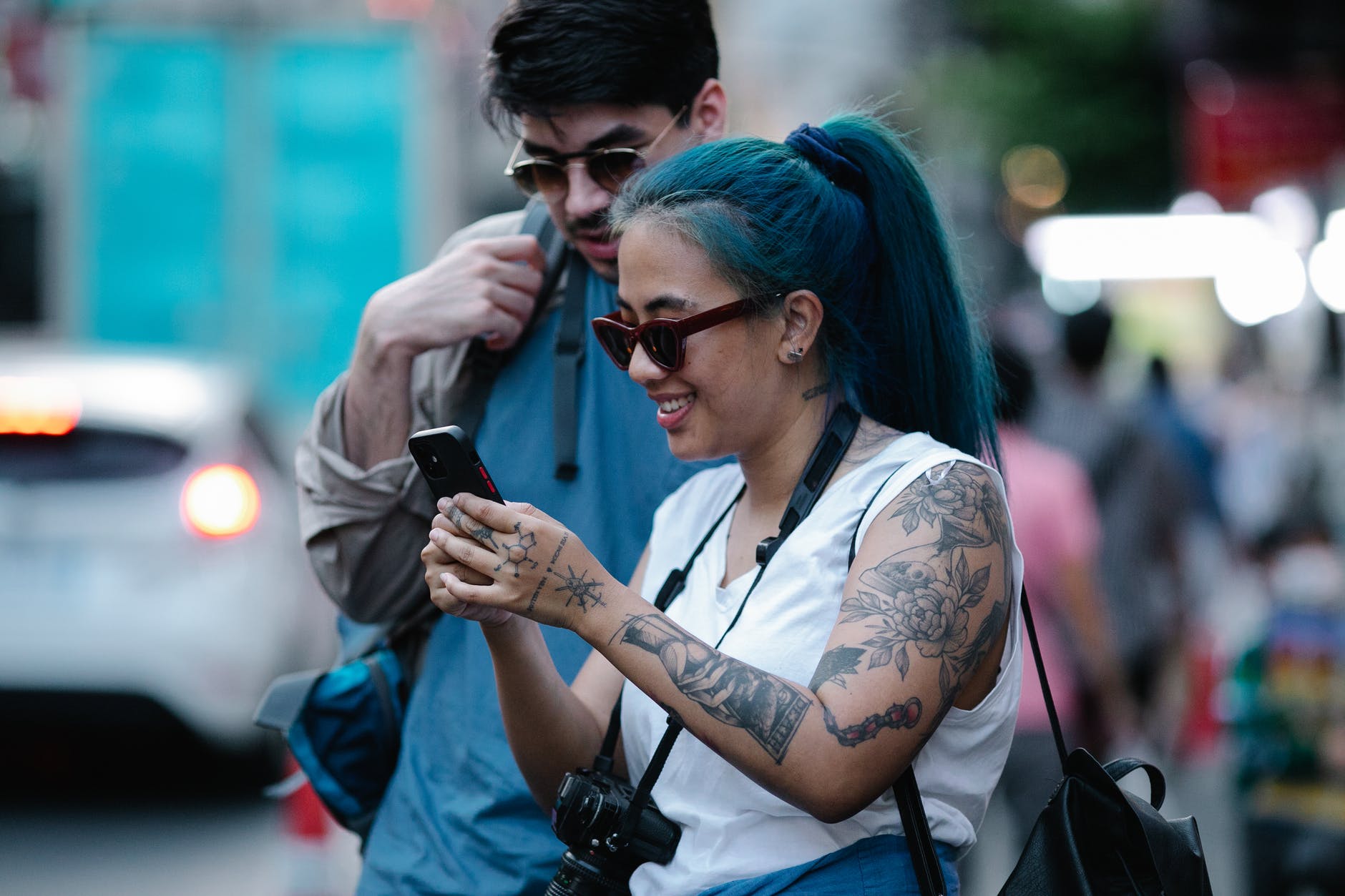 woman holding a black smartphone