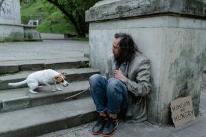 a homeless man with a dog