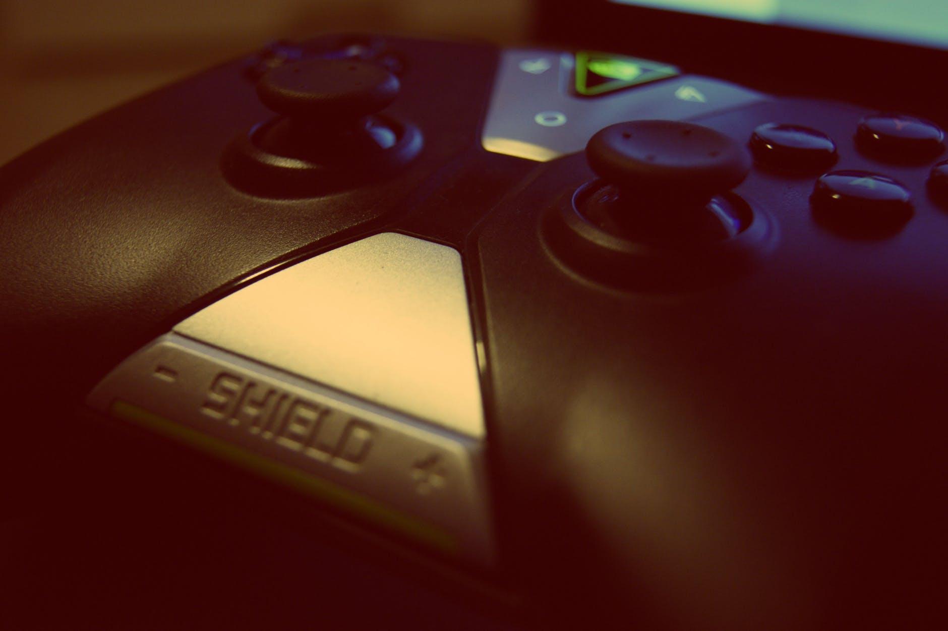 black shield game controller close up photography