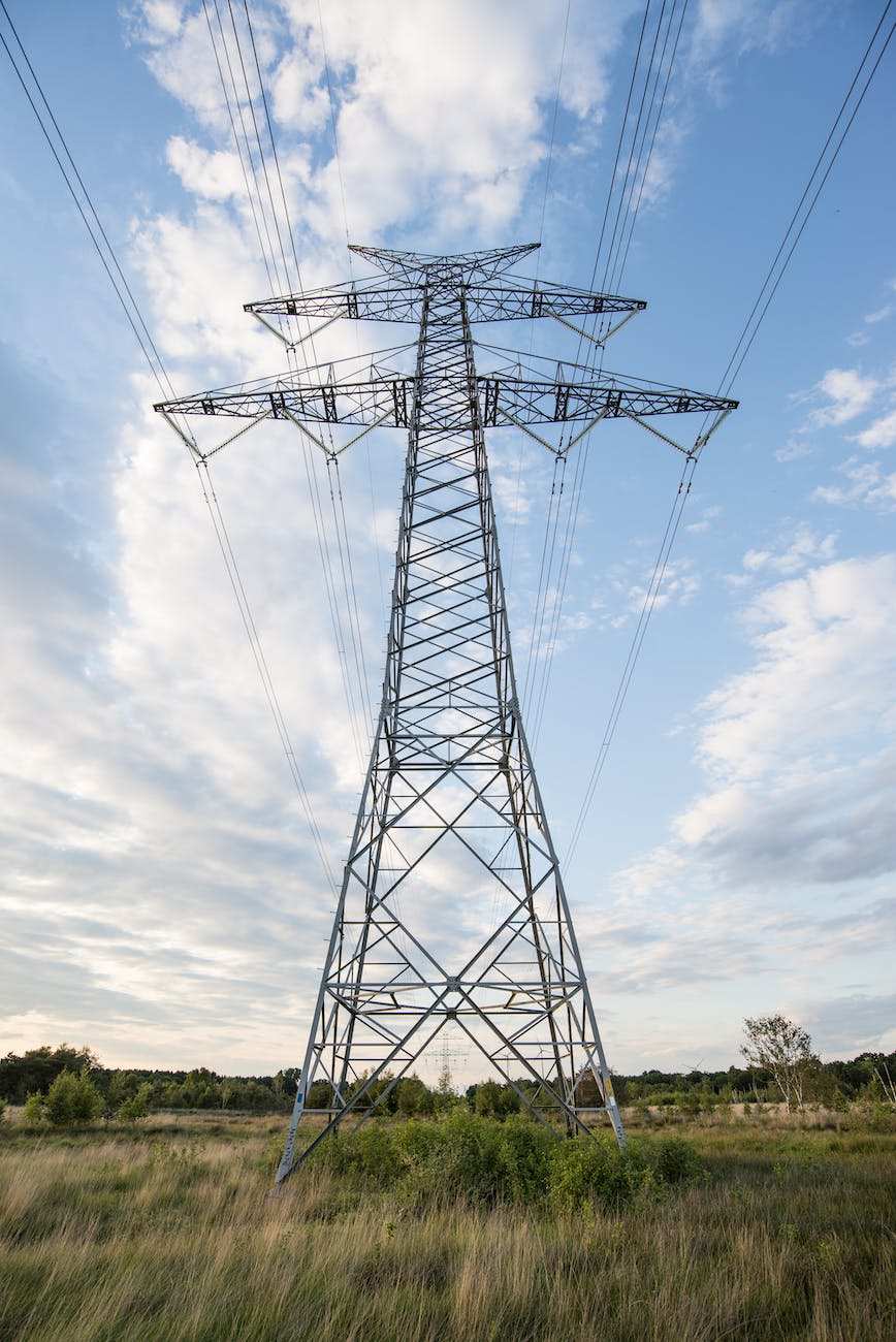 low angle photo of gray transmission tower