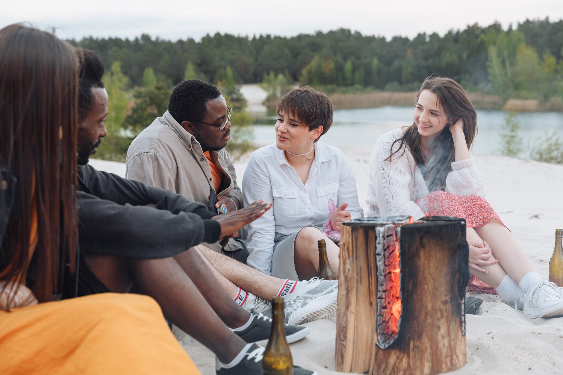 people sitting on beach sand