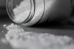 selective focus photo of salt in glass jar