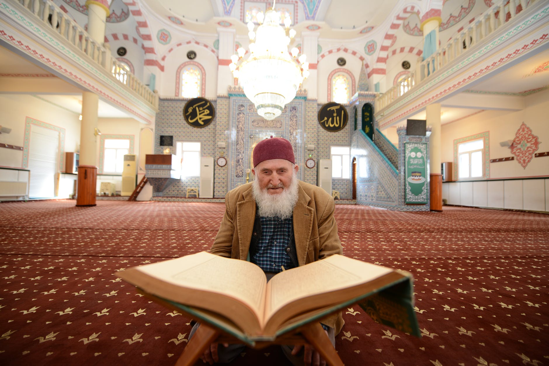man praying in mosque