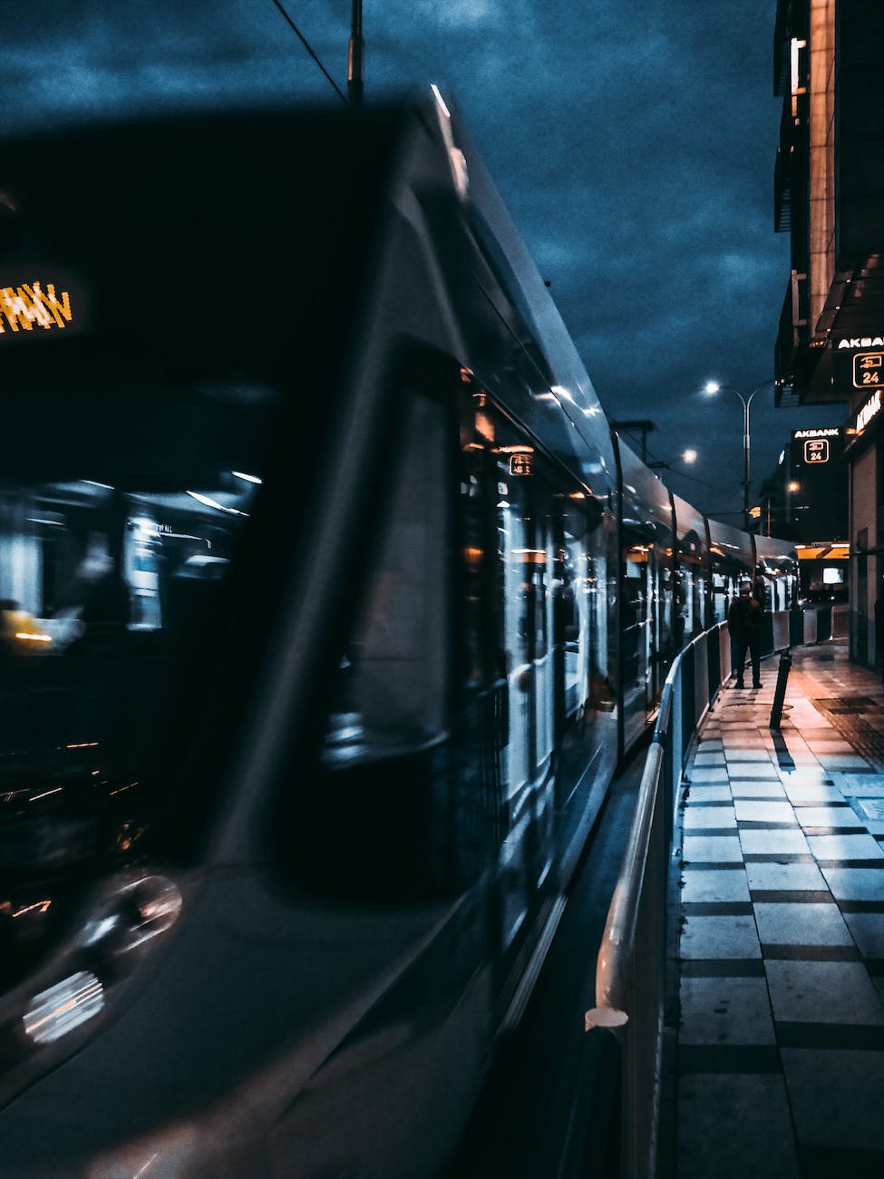 black train on road during night time