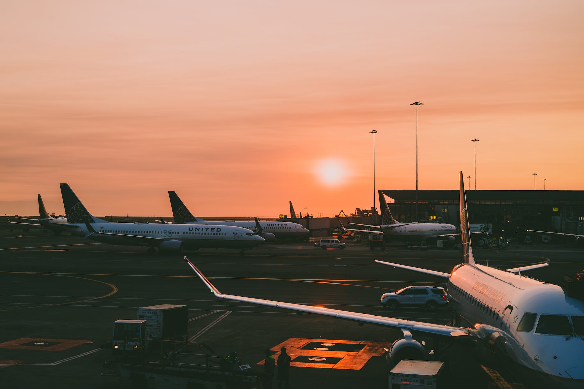 photo of airplanes during dawn