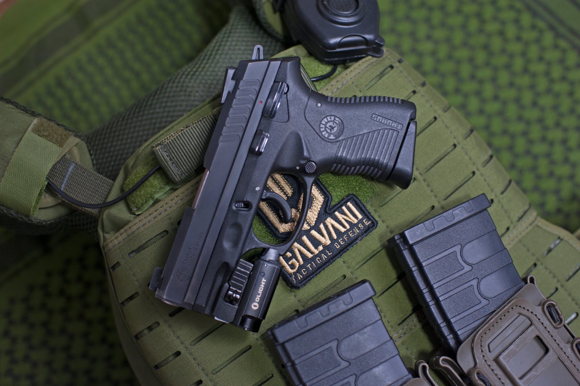 close up of a military vest with guns