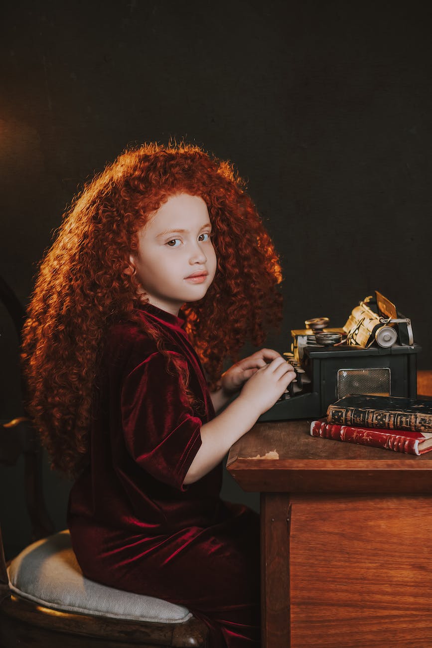 a redhead girl with a typewriter