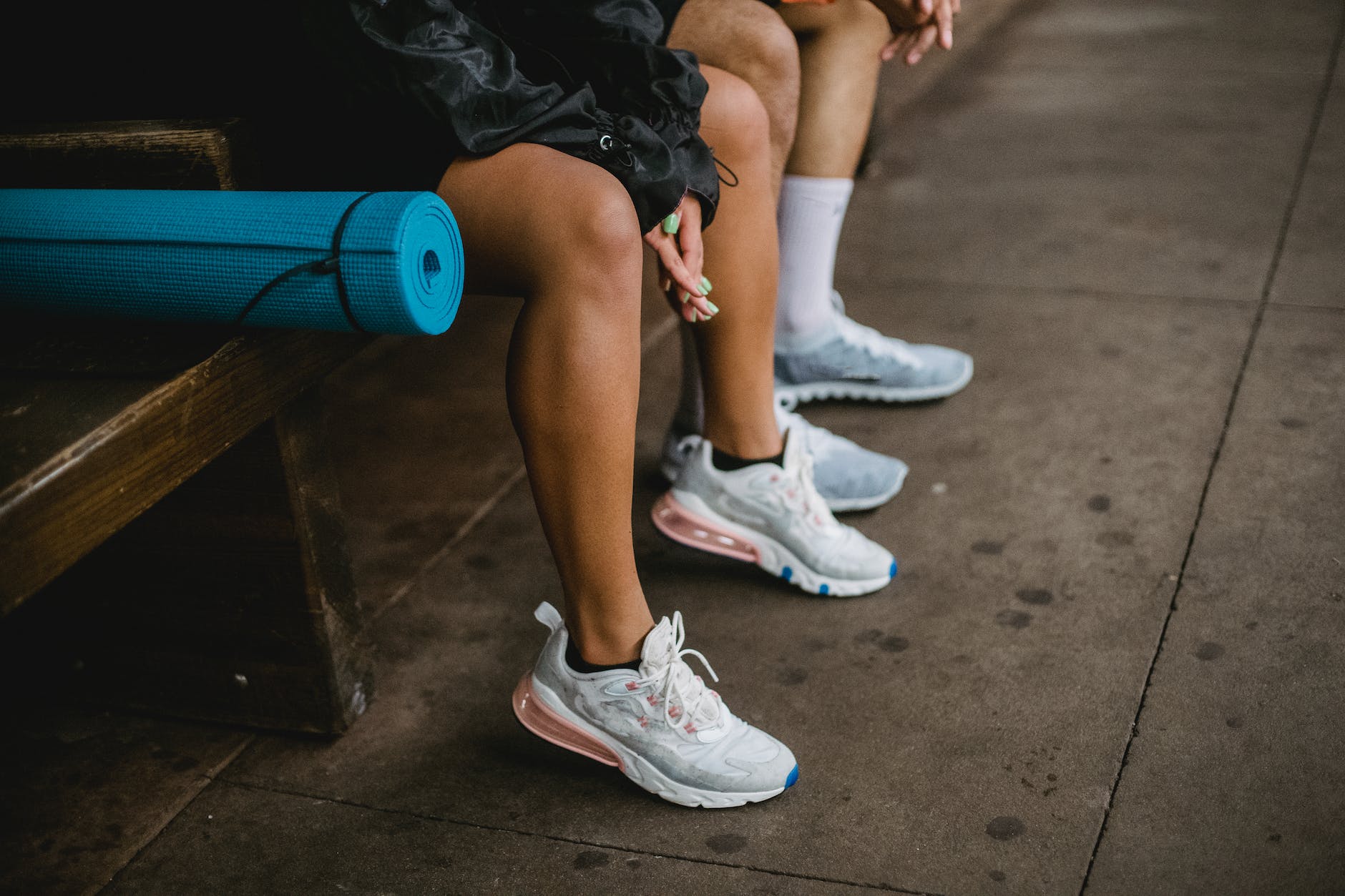two people wearing sneakers