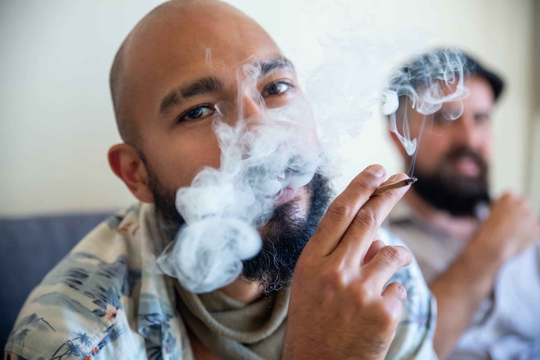 bearded man smoking a joint