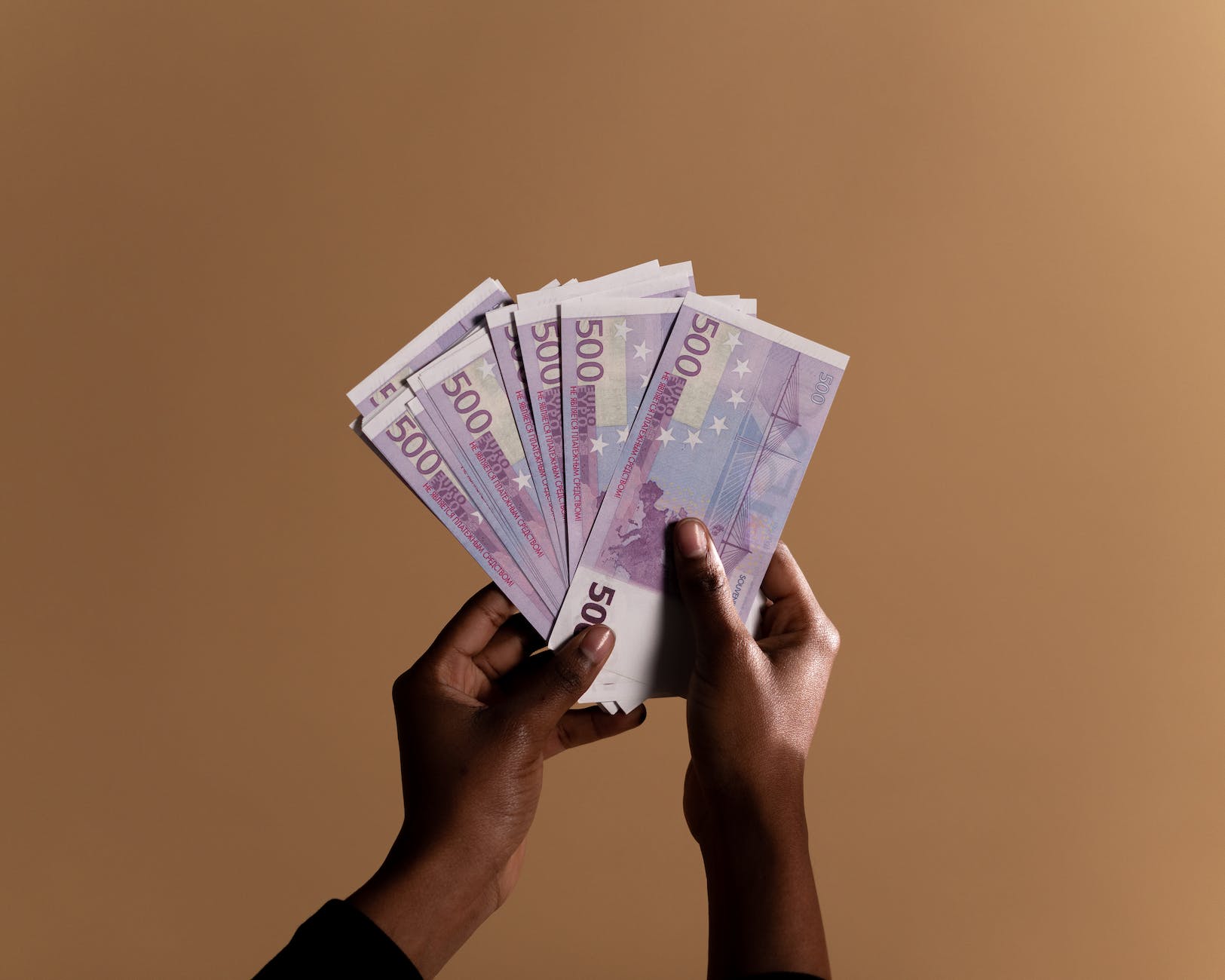 person holding banknotes