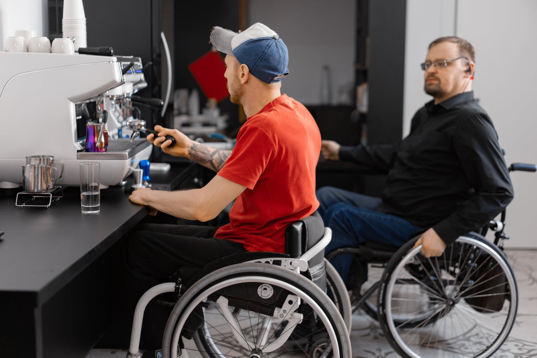 people in wheelchair working in a coffee shop