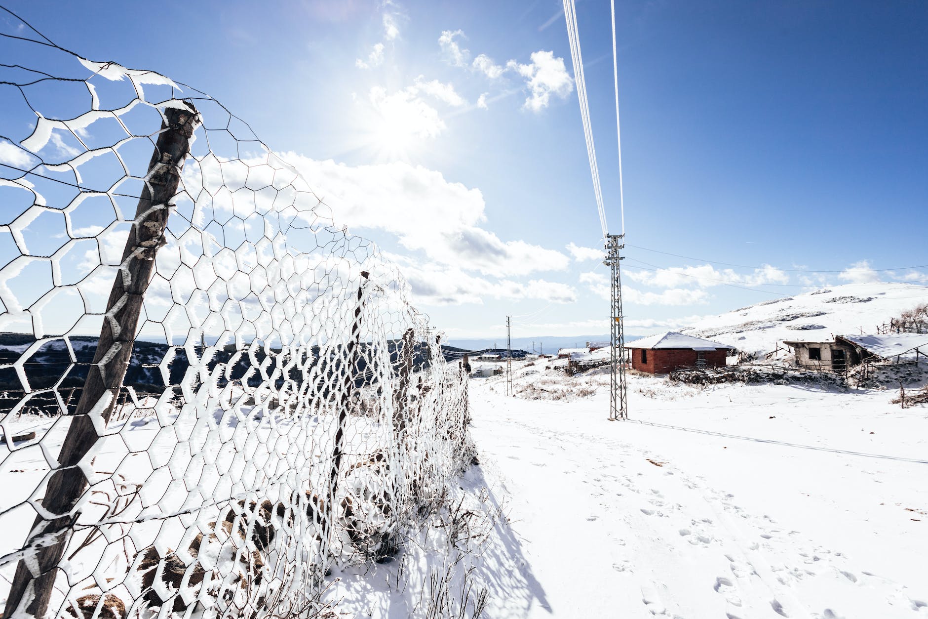 fence in village in winter