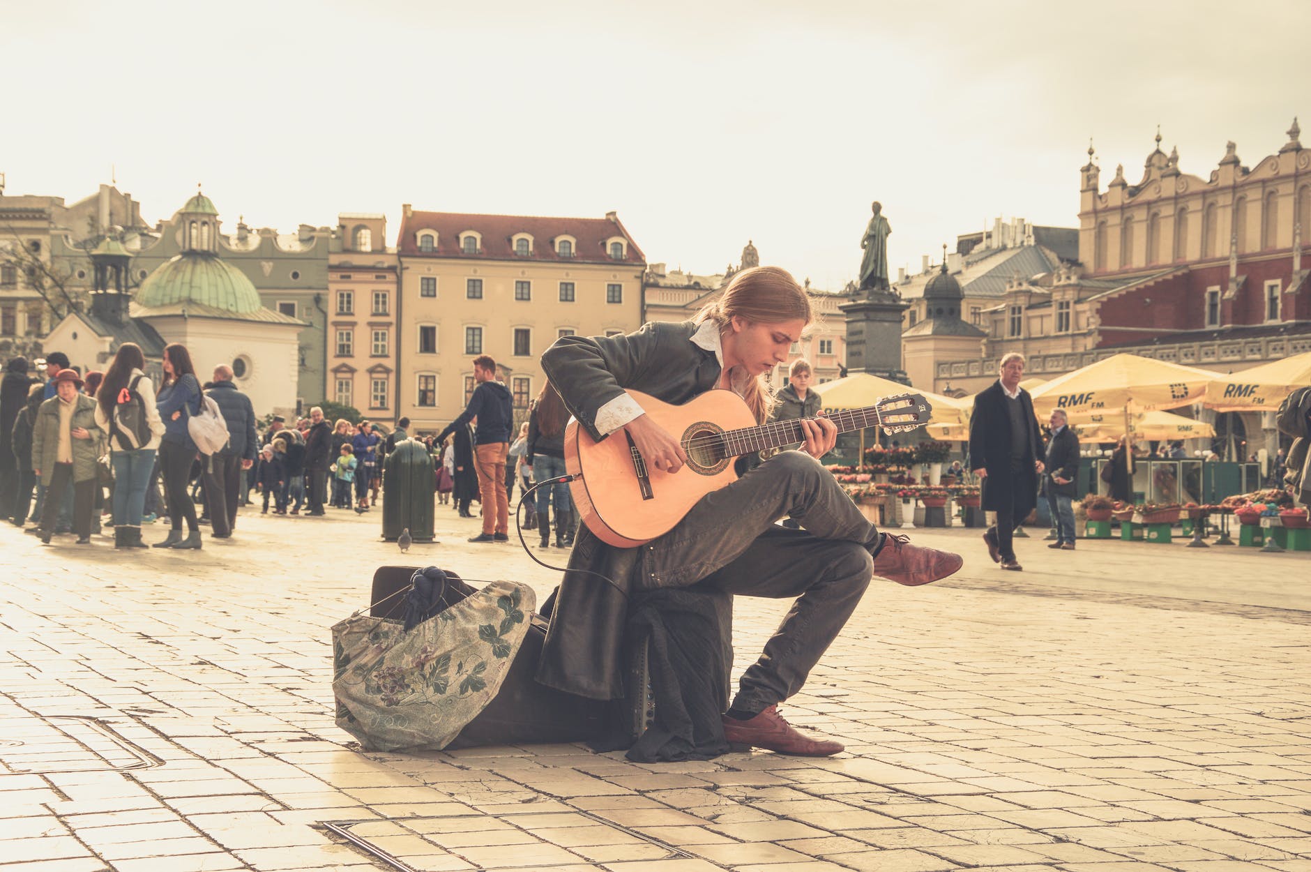 man playing acoustic guitar