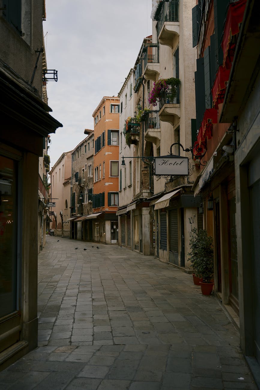 narrow pedestrian street between old residential buildings