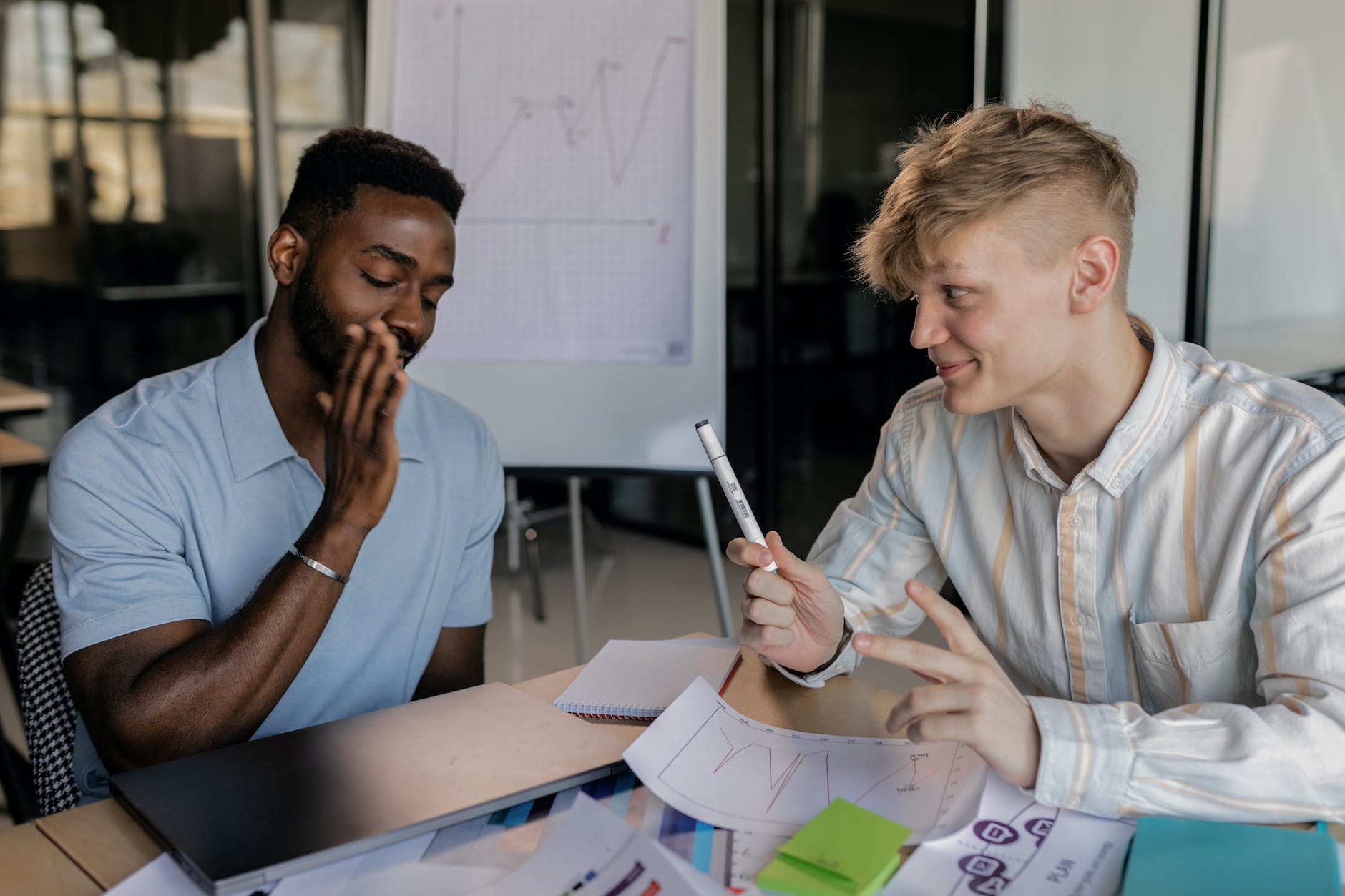 two men study together