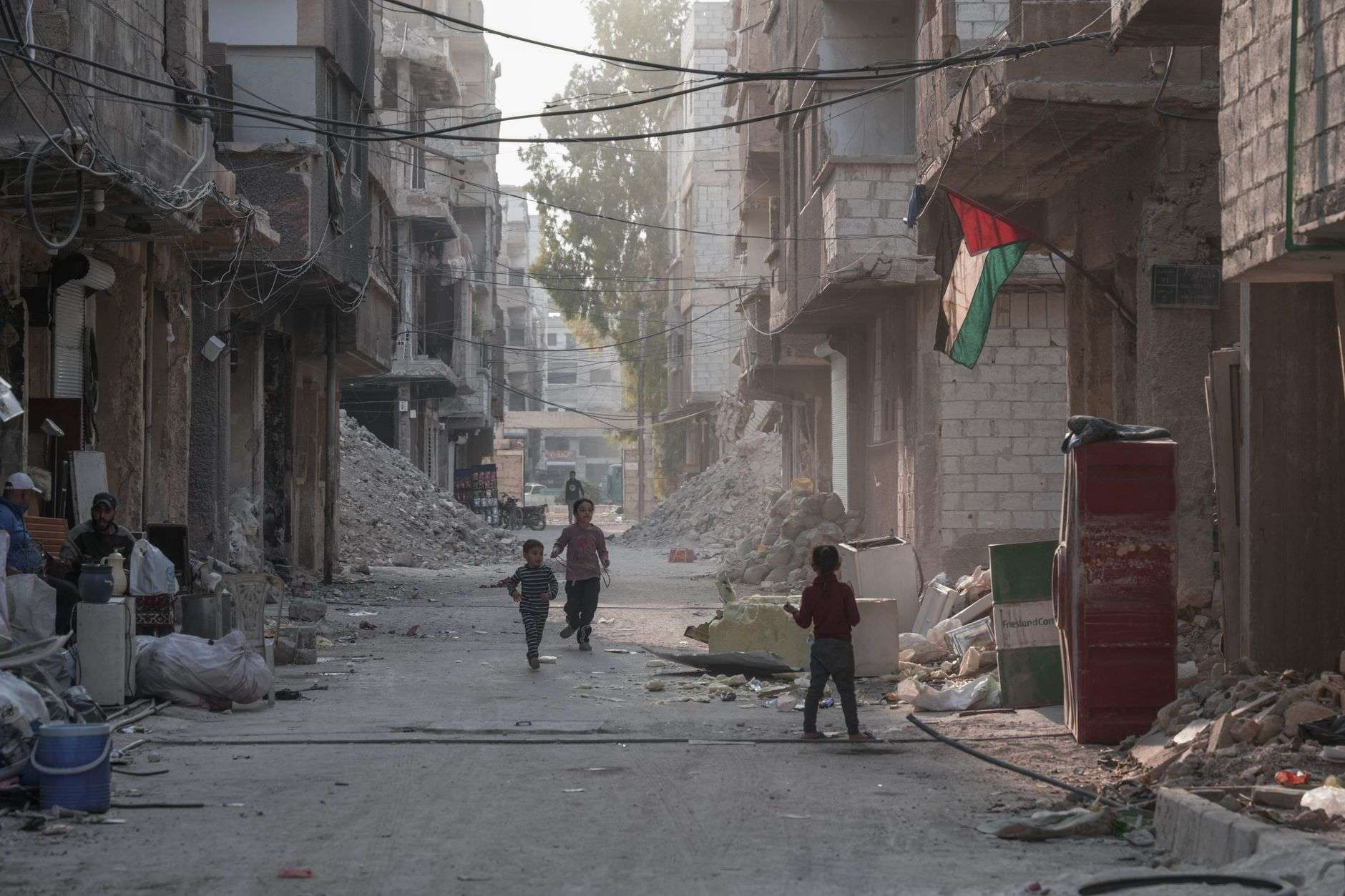 children playing in damascus war torn street