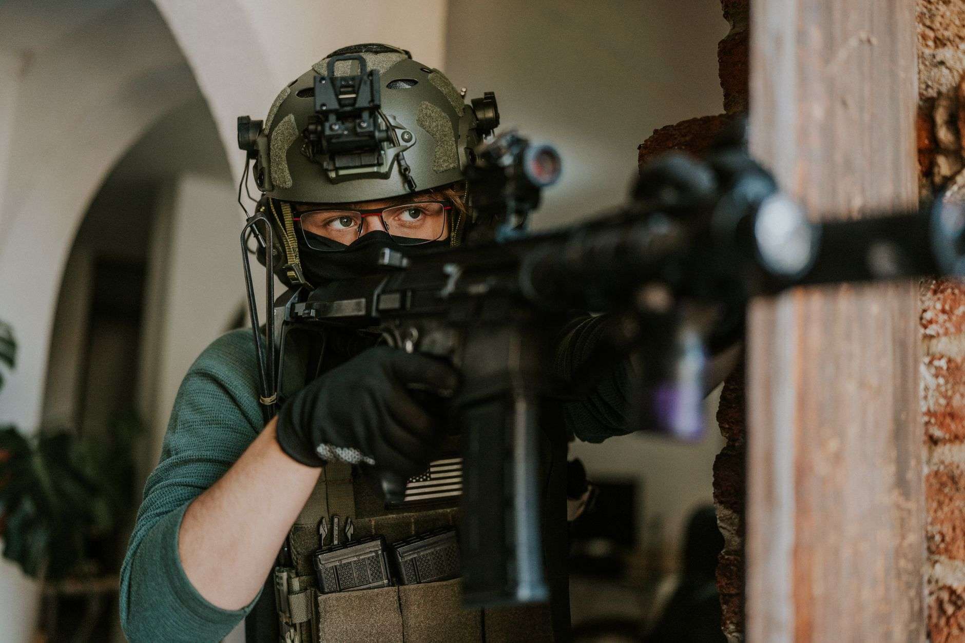 tactical soldier aiming with precision indoors